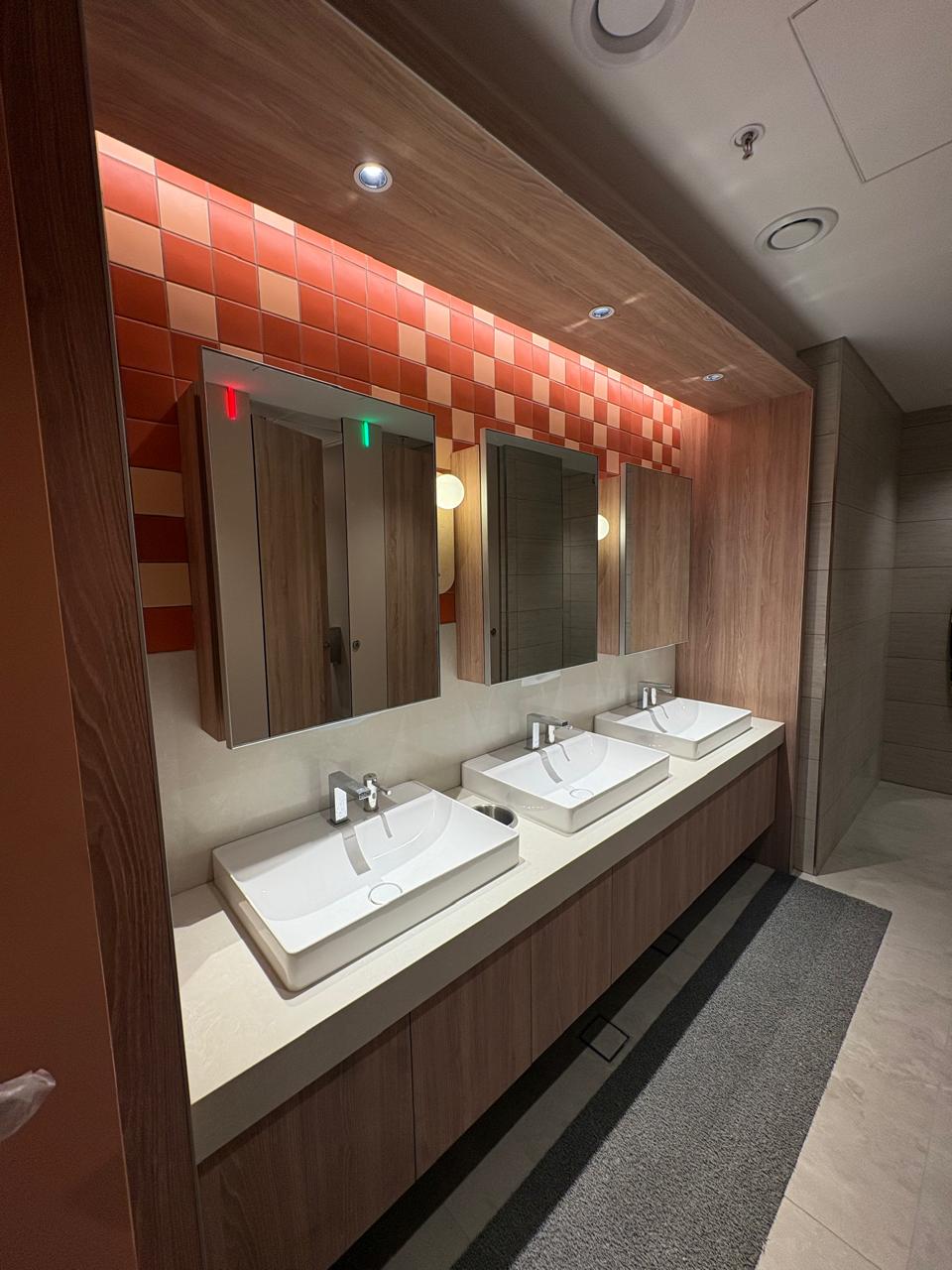Intuit Bengaluru washroom vanity with LED edge-lit mirror cabinets